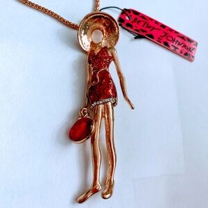 Lady in red dress pendant necklace by Betsey Johnson